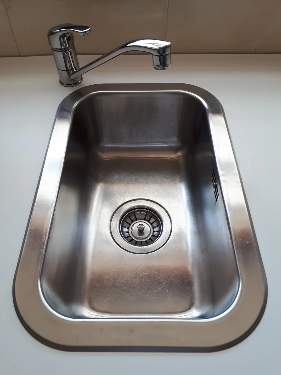 Small sink and faucet in a compact kitchen
